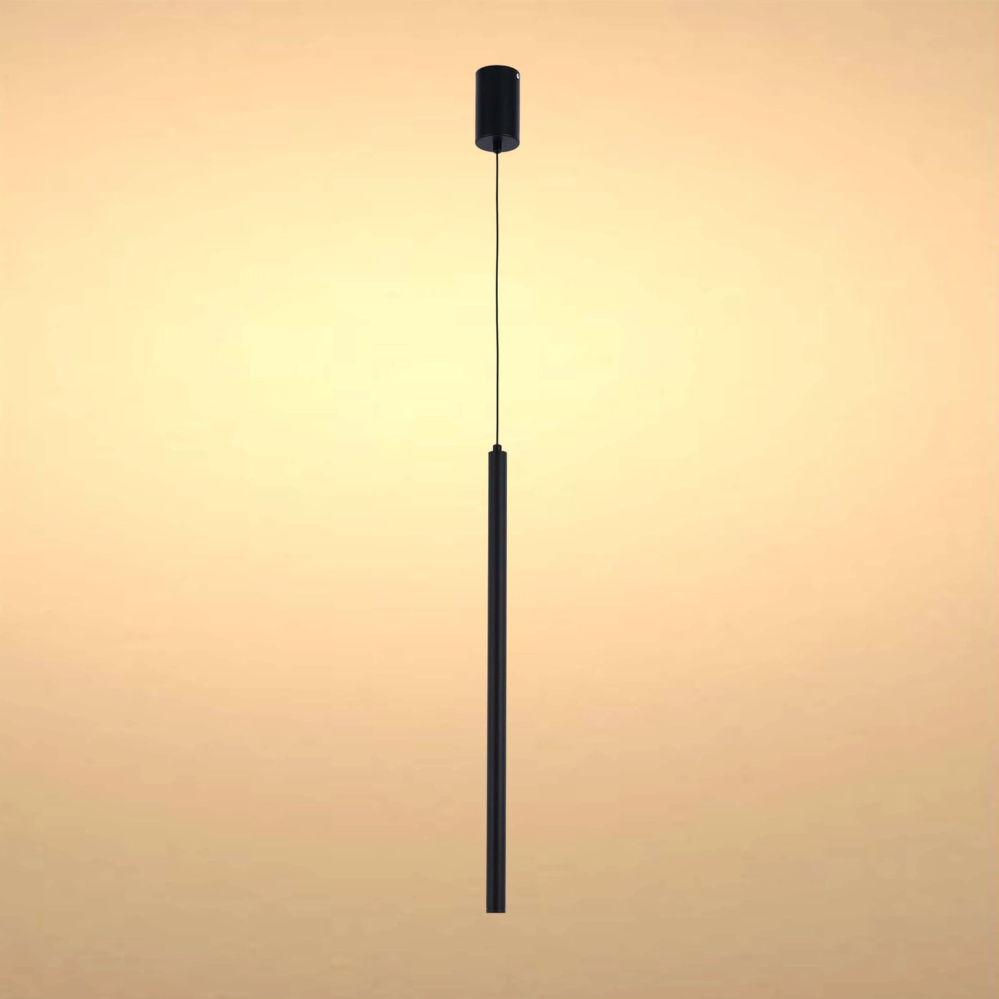 Sleek, modern pendant light in black. Suspended from a single cord, it emits a warm, inviting glow.