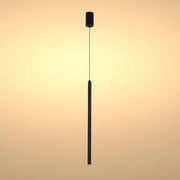 Sleek, modern pendant light in black. Suspended from a single cord, it emits a warm, inviting glow.