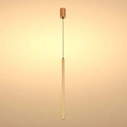 A modern, minimalist gold pendant light fixture with a long, slender cylindrical shade suspended from a black cable.
