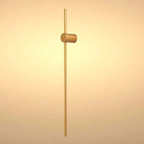 Minimalist gold wall light with cylindrical shade and slim linear stem, perfect for modern homes.