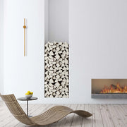 Stylish modern lighting complements a contemporary space. Natural light enhances a wall-mounted minimalist lamp and flickering fire.