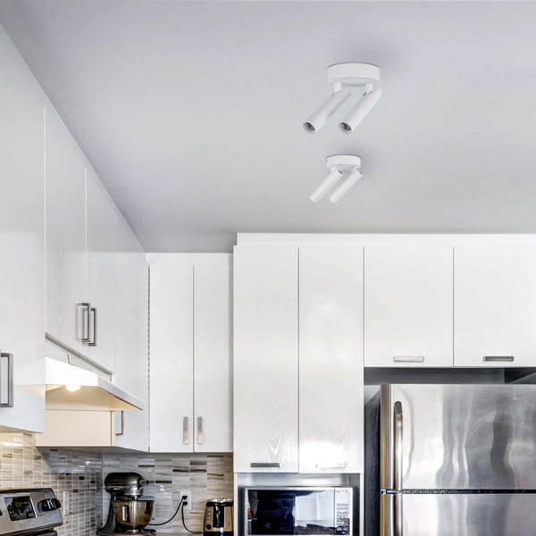 Modern kitchen spotlights. Two ceiling-mounted, adjustable fixtures provide directed light in a sleek white finish.