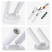 A modern, white double spotlight featuring adjustable cylindrical heads and a minimalist design. Ideal for directional lighting in any room.