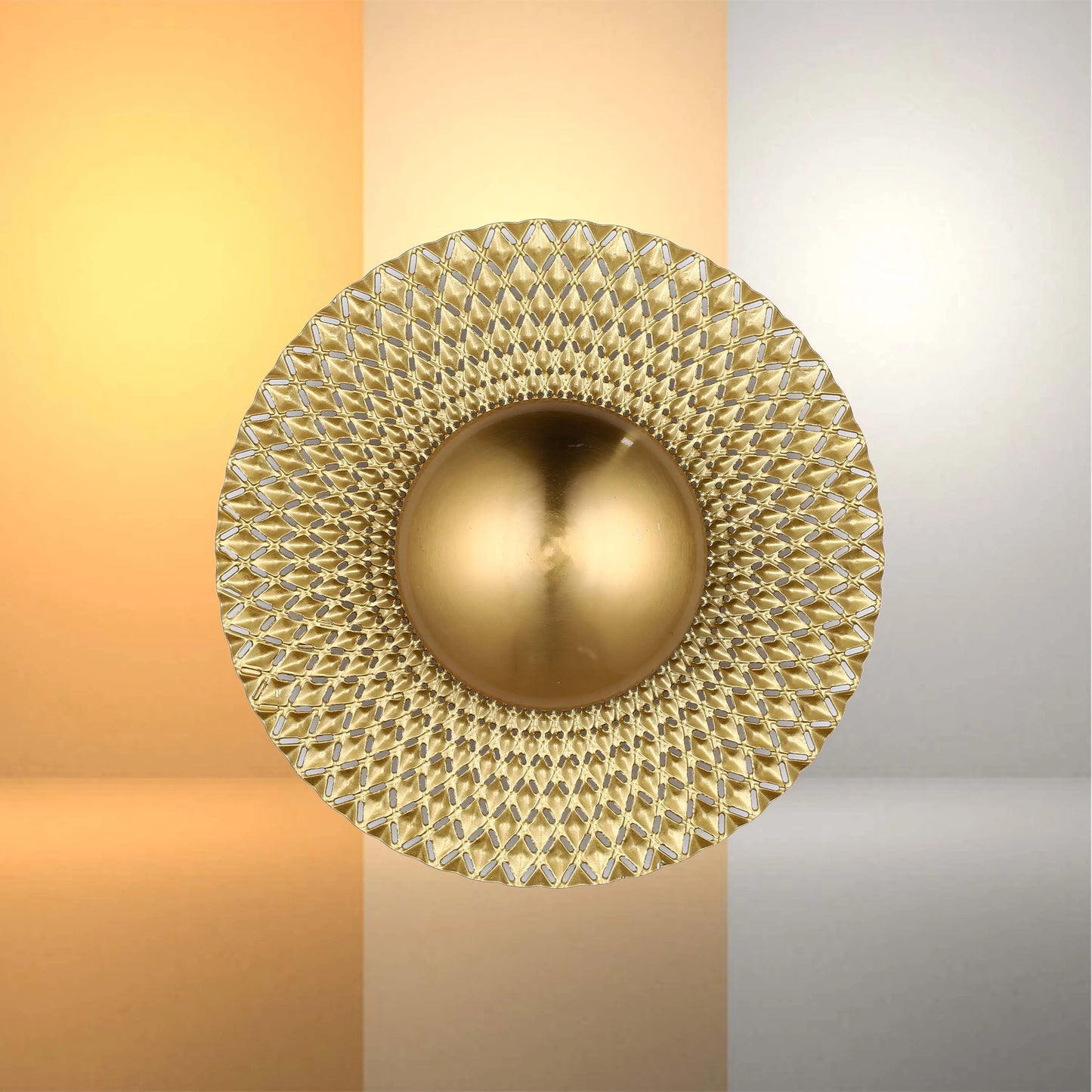 A gold wall light with a round, textured shade, evenly lit with a soft, diffused glow.