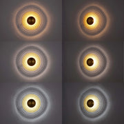 A collection of wall lights, featuring warm to cool tones and decorative diamond patterns, creating a distinct ambience.