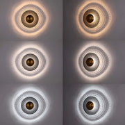 Six variations of the same wall light, showing a unique light pattern created by the fixture in different colour temperatures.