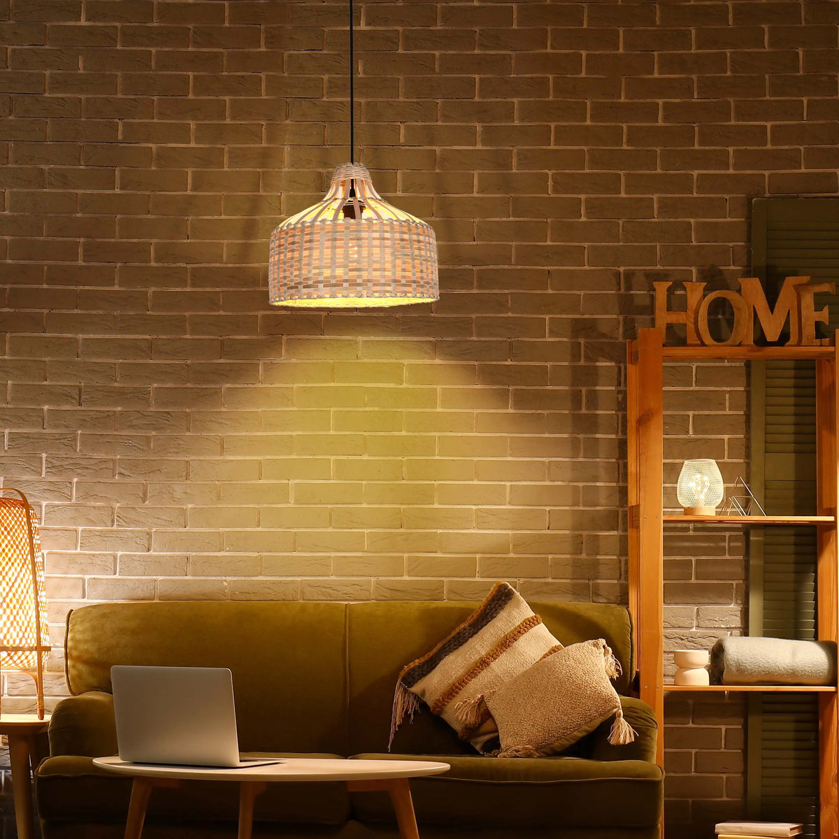 Ambient lighting sets a cosy mood. A wicker pendant light glows above an olive velvet sofa, complemented by a side table lamp.