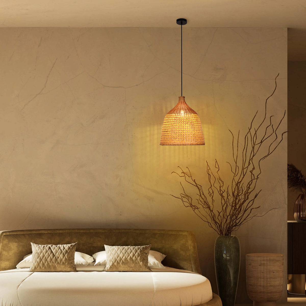 A warm, wicker pendant light hangs above a luxurious bed, creating a cosy and inviting bedroom atmosphere.