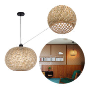A woven bamboo globe pendant light with black fitting. Modern, minimalist style lighting for a unique look.