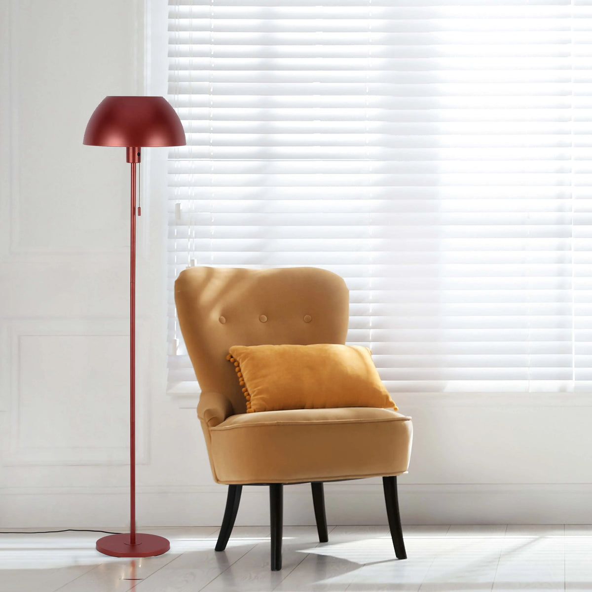An elegant interior with a floor lamp that provides focused ambient light for reading, next to a tan armchair.