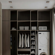 Square recessed ceiling lights provide a modern and functional lighting solution for a laundry and storage space.