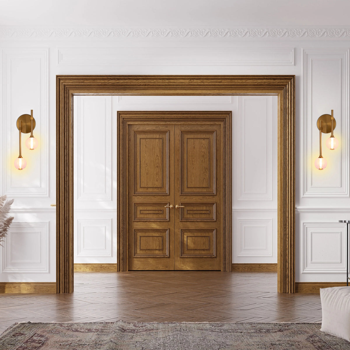 Elegant wall lights illuminate a grand doorway. Twin bulb, brass fixtures offer a warm glow within an ornate, traditional setting.