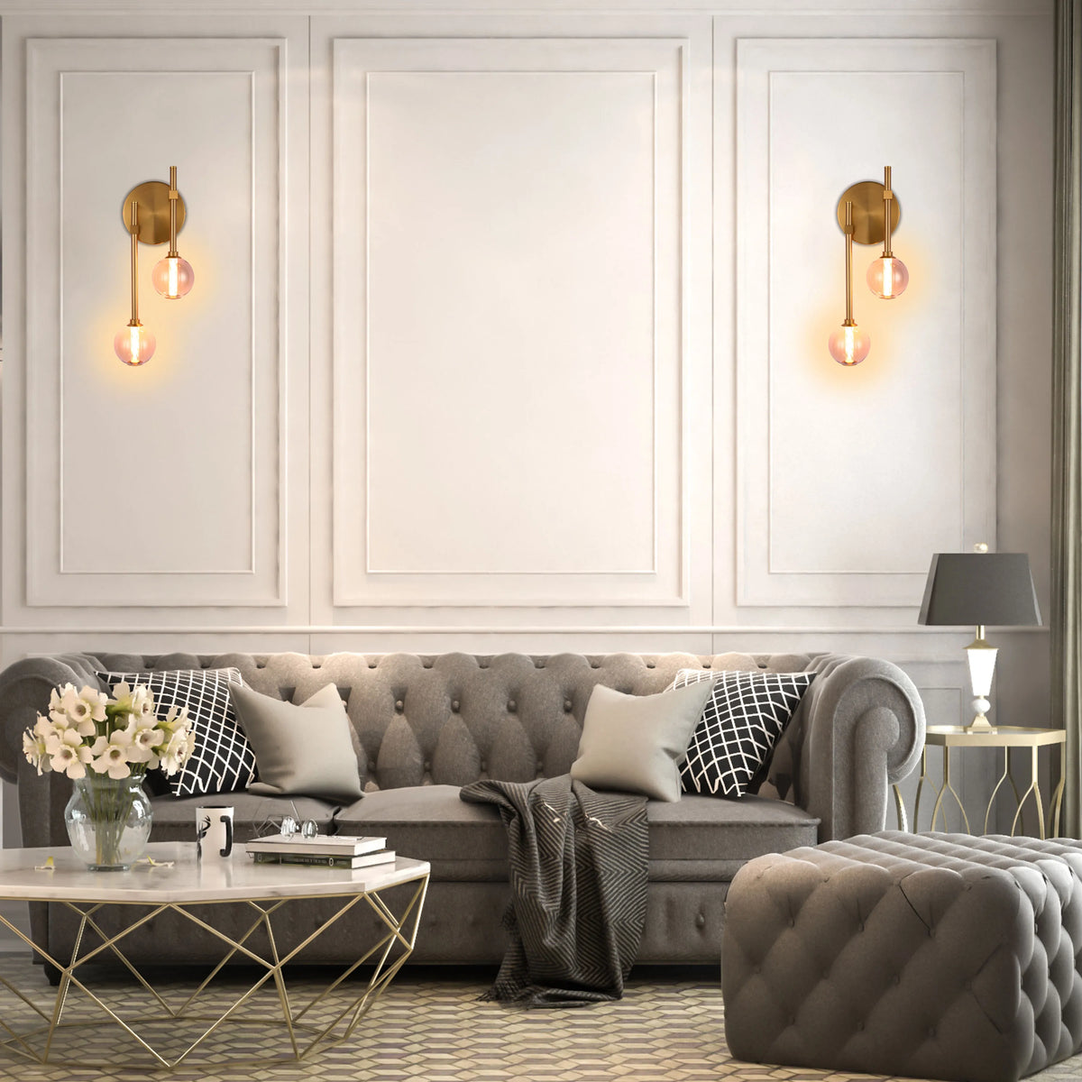 Elegant wall sconces with warm, glowing spherical shades. A classic table lamp adds soft light to this inviting living space.
