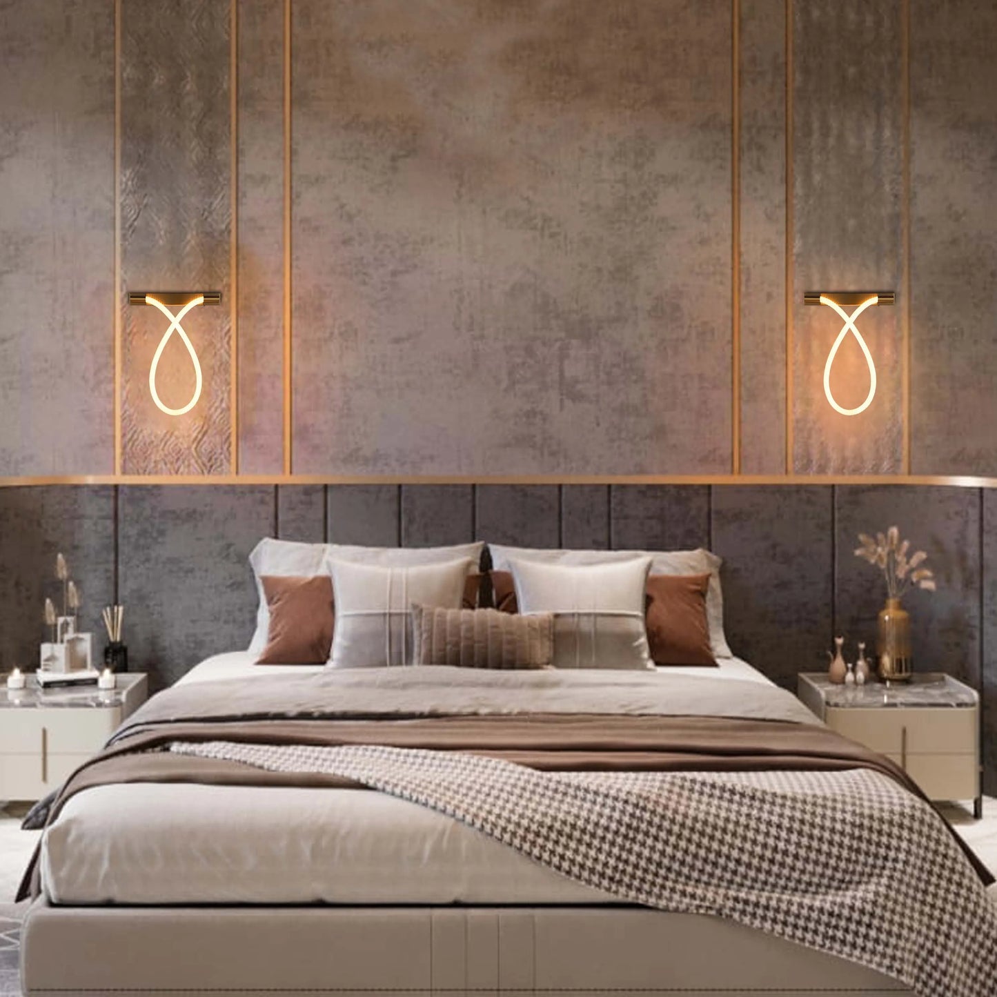 Elegant wall sconces emit a warm glow, adding a modern touch to this luxurious bedroom's ambient lighting.