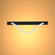 A soft, diffused light accentuates the black horizontal fixture, contrasting beautifully with the light rope handle against a warm-toned backdrop.