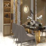 An illuminated ring light fixture, accent lighting in a display cabinet and recessed lights throughout the room.