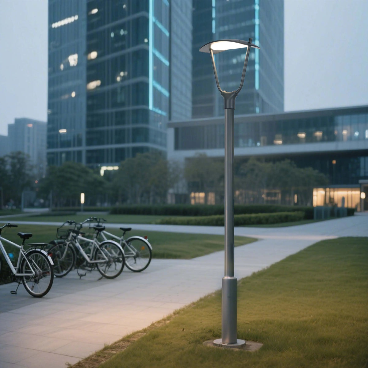 Modern street lighting illuminates a public space, with office buildings in the background, creating a welcoming and safe environment.
