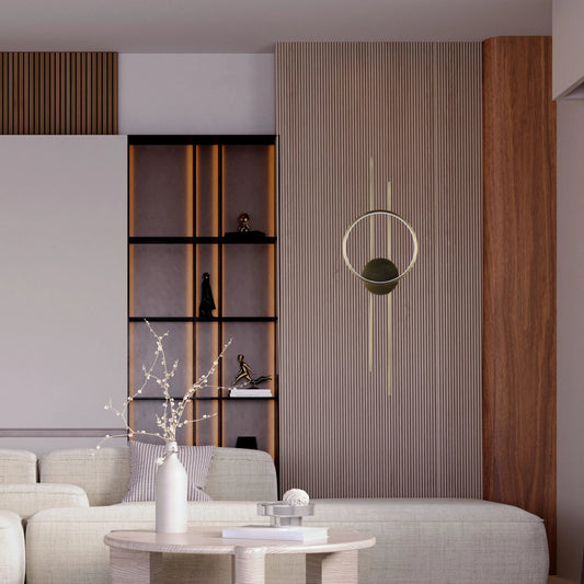 Ambient interior lighting. A feature wall with built in shelving and a minimalist gold circular wall light.