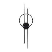 Modern wall light with a black stem, circle, and disc design. The circle is illuminated with a white light for a stylish finish.
