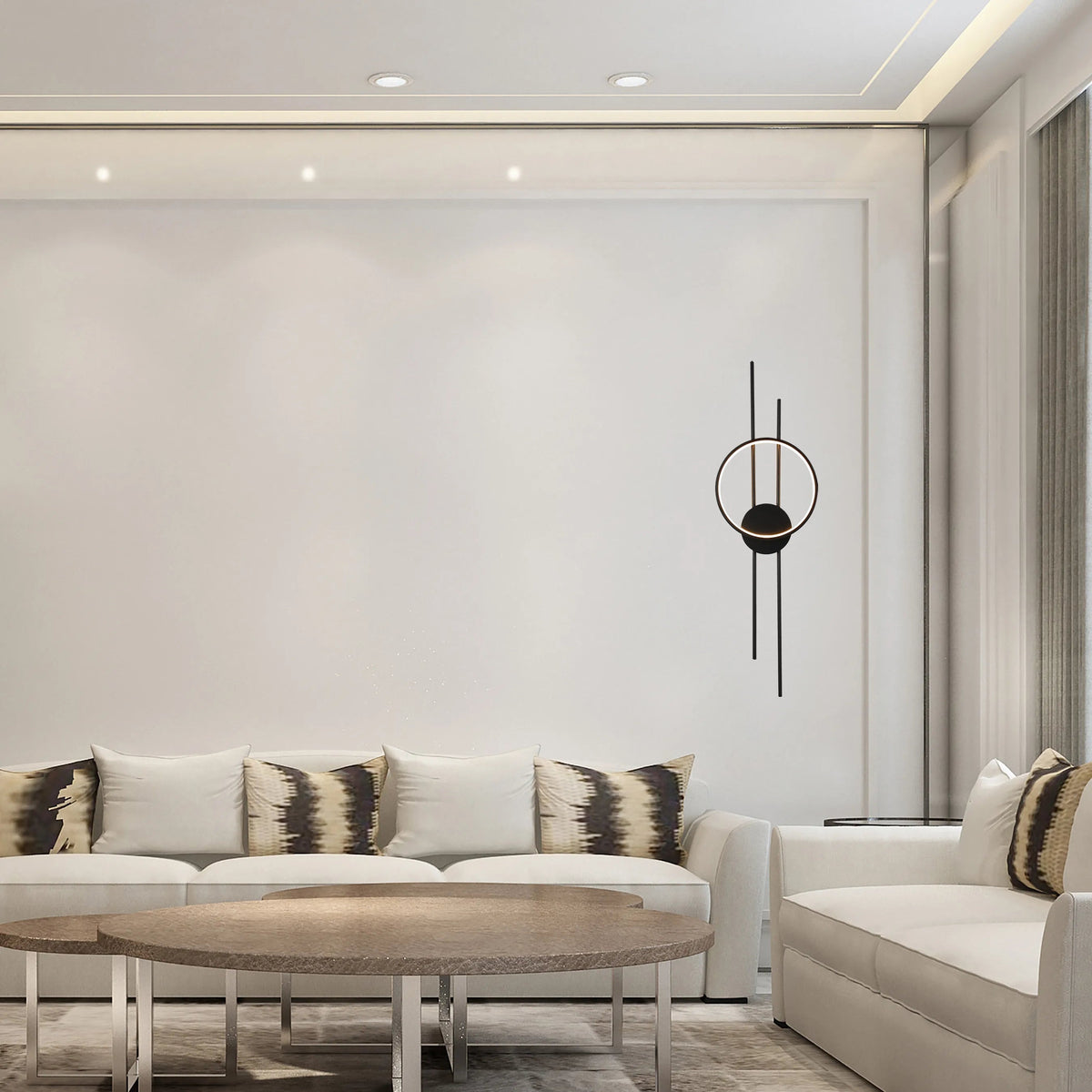 Ambient lighting from recessed spotlights and a unique black and gold wall sconce create a modern, stylish living space.