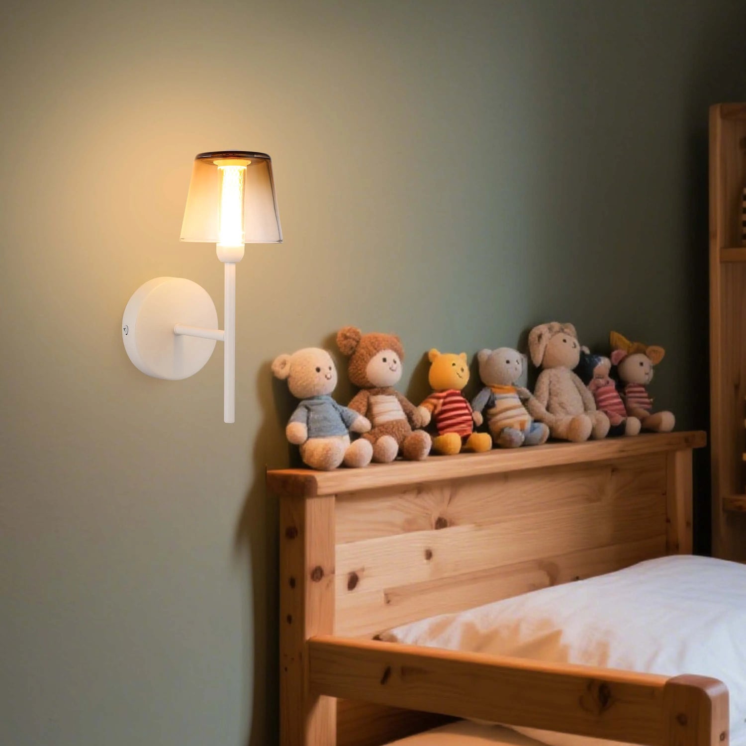 Wall mounted sconce provides warm, ambient light. Perfect for a child's bedroom.