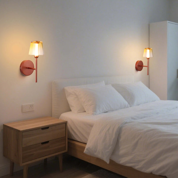 Bedroom with matching wall sconces either side of the bed, casting a warm, atmospheric glow.