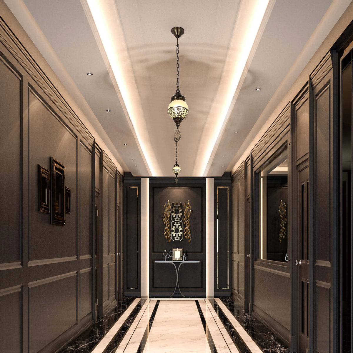 A hallway with ornate pendant lights and integrated ceiling lighting provides a warm and inviting glow.
