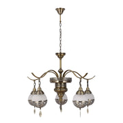 An ornate chandelier with bronze finishings and spherical glass shades.