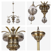 A gold-toned, ornate chandelier with patterned white shades. A statement piece for ambient lighting.