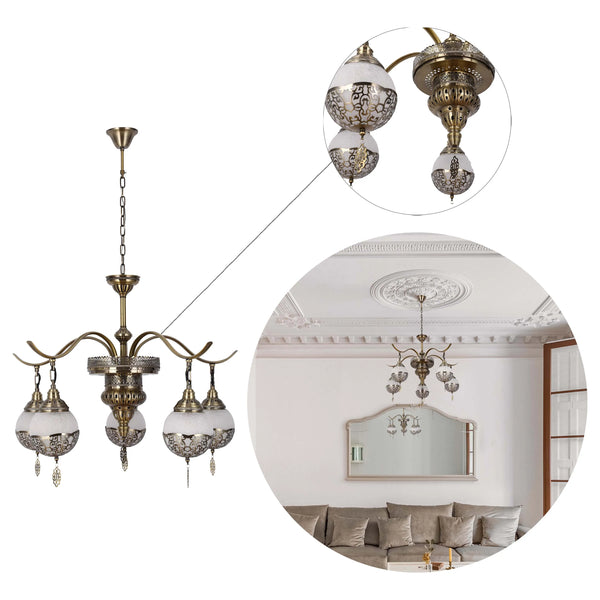 A decorative bronze chandelier featuring five lights, each with patterned glass shades. Creates a warm and inviting atmosphere.