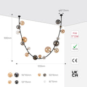 A modern globe pendant light in smoke and amber glass with black wire, showing dimensions and regulatory marks.
