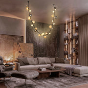 A stylish living room featuring a modern, orb pendant light fixture, providing a warm and inviting ambiance.