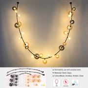 A stylish chandelier featuring a black steel frame adorned with smokey, amber, and clear glass bulbs. It's dimmable with the right bulbs.
