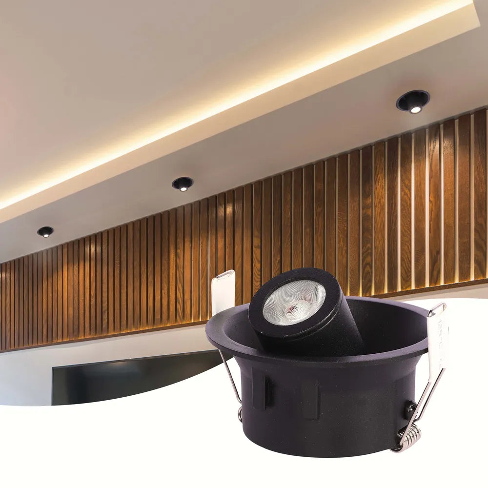 Modern LED downlight illuminates a minimalist living room, enhancing contemporary decor with sleek, adjustable lighting for a cozy ambiance.143-03420