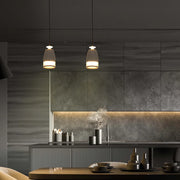 Modern pendant downlight with polycarbonate ring diffuser, enhancing a cozy living room decor with warm white light. Ideal for stylish interiors.150-19078