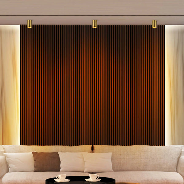 Ambient lighting with three gold, cylindrical downlights, flanking a decorative panel and soft, natural curtains.