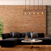 Rose gold accent metal pendant light in a modern dining room, adding a stylish touch to contemporary decor and ambiance.159-17030