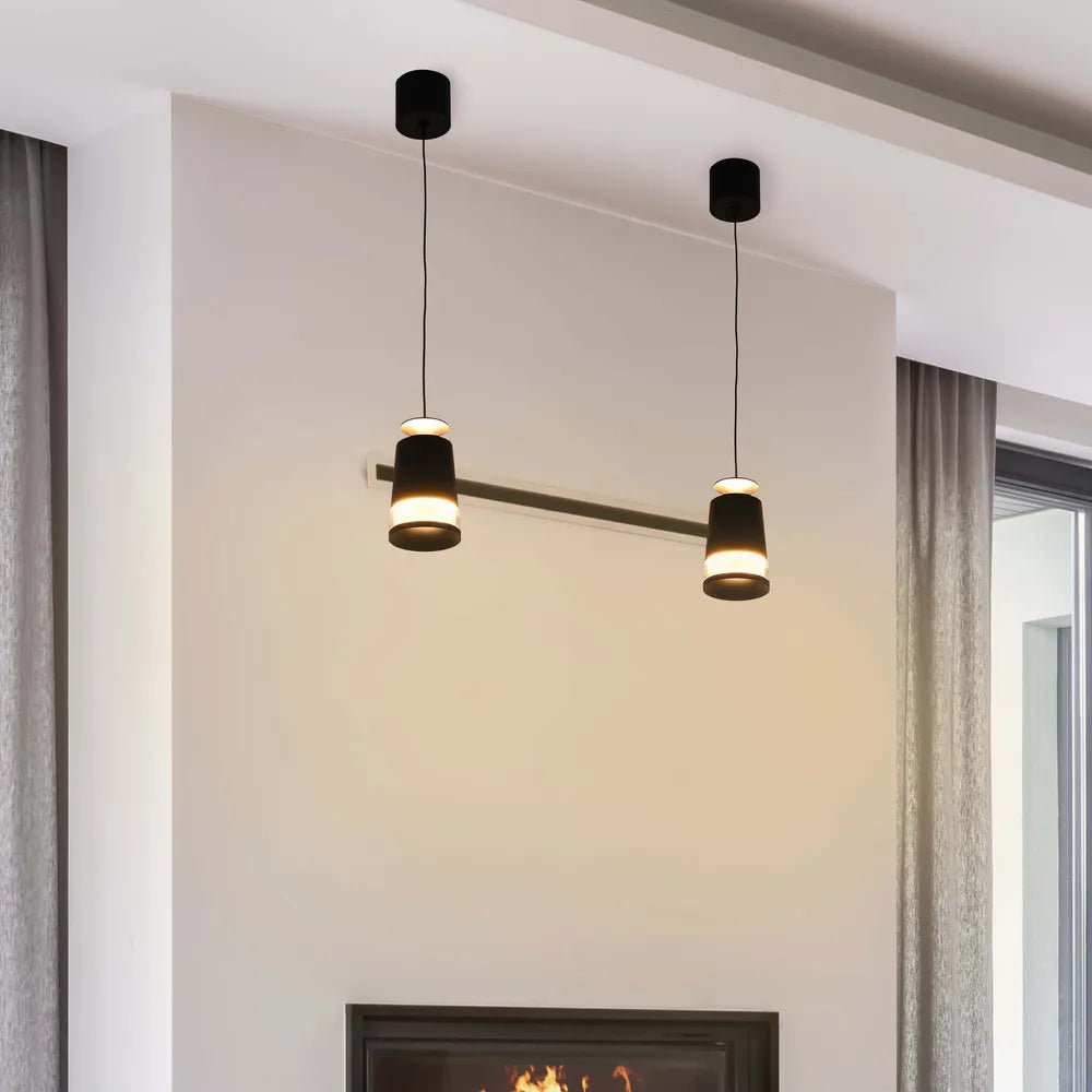 Modern black pendant downlight illuminating a stylish kitchen with warm white light, enhancing contemporary decor and creating a cozy ambiance.150-19082