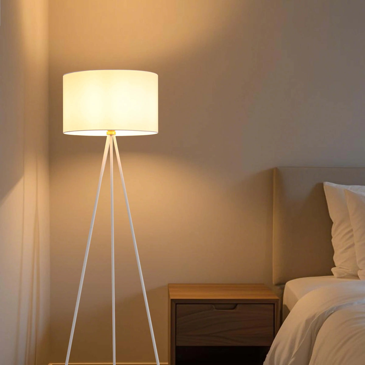 Illuminated room with a floor lamp. The lamp is glowing brightly, casting a warm light onto the wall and surroundings.