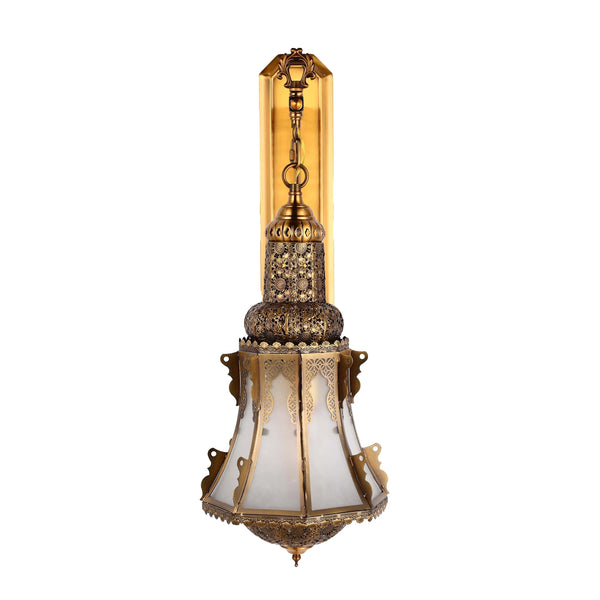 Ornate gold wall light with patterned shade. Decorative and adds a touch of class to any room.