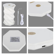 A portable, accordian style LED table lamp with a gold touch sensor, USB charging cable and lanyard. White and gold colour scheme.
