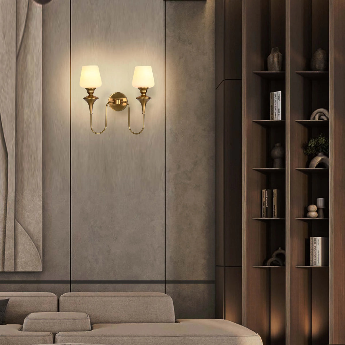 A wall mounted sconce with a polished brass finish and frosted glass shades creates warm, inviting ambient lighting.