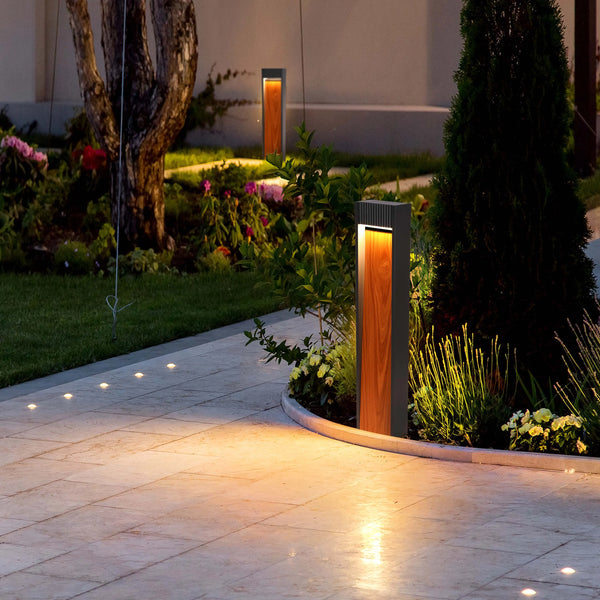 Garden path lights illuminate stone paving & flowerbeds. Wood & metal bollard lights add style with an upward, warm glow.