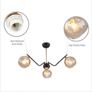 Close up of Amber Cone Glass Black Gold Metal Spider Semi Flush Ceiling Light | TEKLED 159-17182