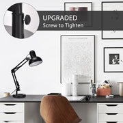 A tidy workspace with a black desk lamp, wooden chair, and white drawer units under a dark grey desk top.