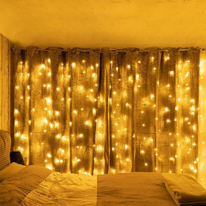 Milkyway 18 Strands 306 LEDs 3mx3m with Power Adaptor Warm White LED Curtain Light in use in bedroom