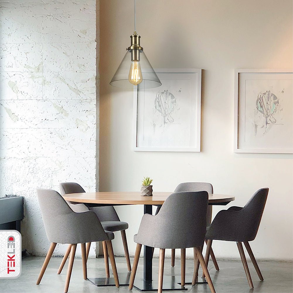 Antique brass metal clear glass funnel pendant light with e27 fitting in indoor setting dining room cafe
