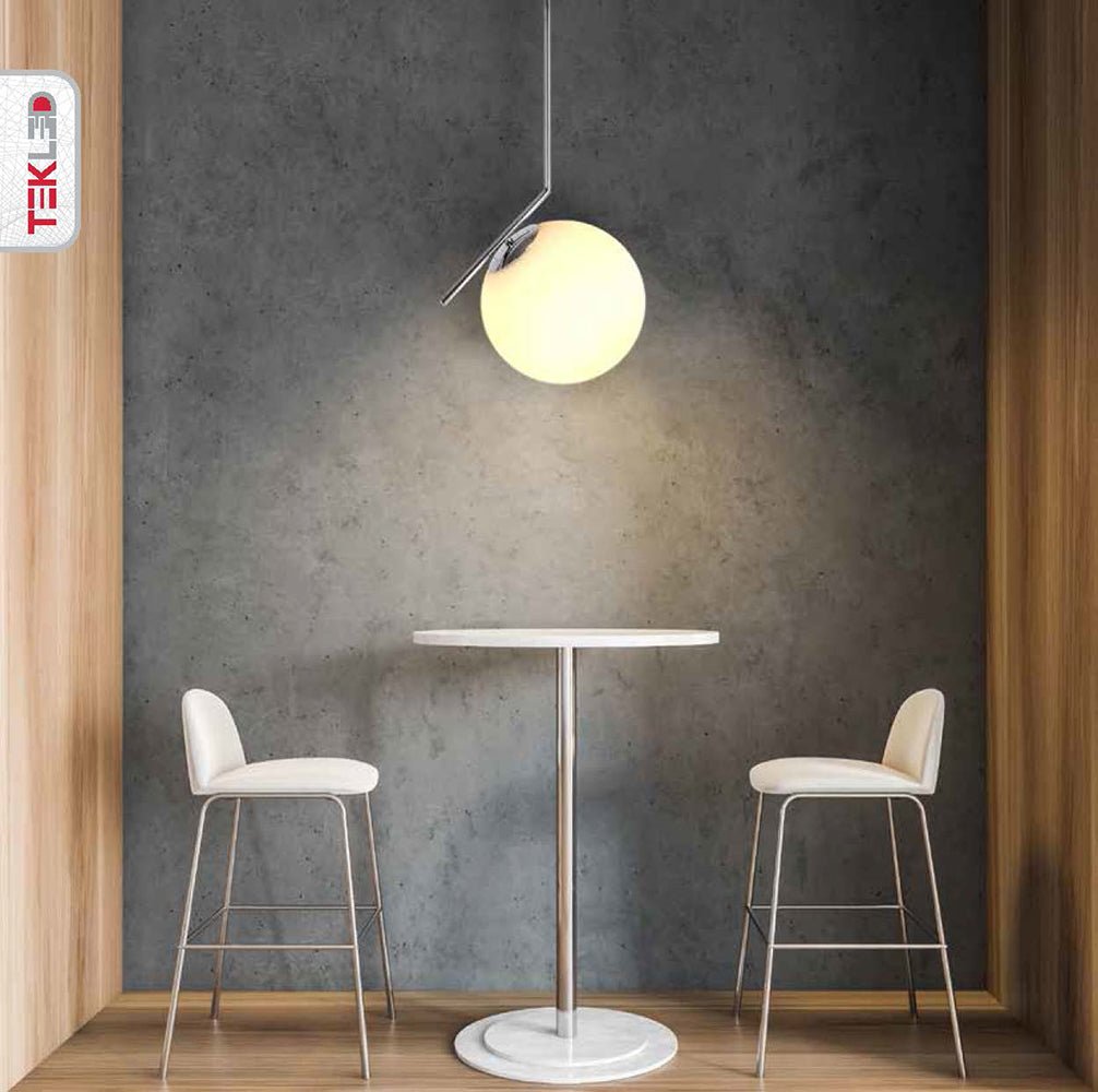 Chrome metal opal white glass globe pendant light m with e27 fitting in indoor setting cafe table top