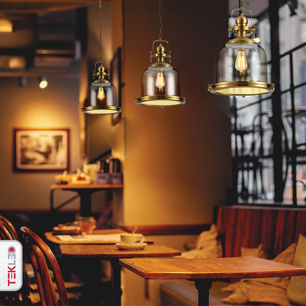 Golden bronze metal amber glass cylinder pendant light sealed with e27 fitting in indoor setting cafe pub