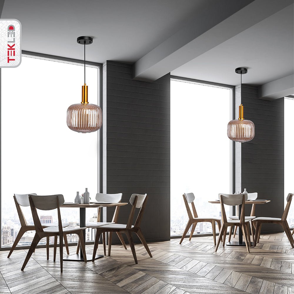 Golden bronze metal amber glass cylinder pendant light short with e27 fitting in indoor setting cafe table top